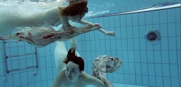  Two hot hairy beauties underwater